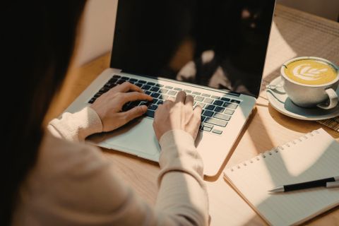 A photo of a girl on a laptop. This photo can be found on New York-based therapist Emma Frank's website and is advertising her virtual therapy practice.